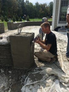 man working on concrete wall